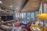 Living Area with Wood Burning Fireplace, Game Table, Access to Deck
